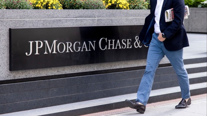 Person walks by JPMorgan Chase headquarters