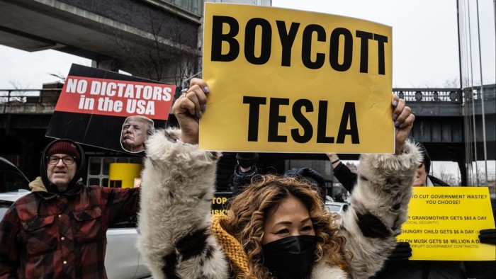 Protesters target Tesla showrooms over Elon Musk’s cost-cutting