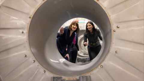 Rachel Reeves, the UK chancellor, looks through the interior of industrial machinery during a factory visit in Oxford