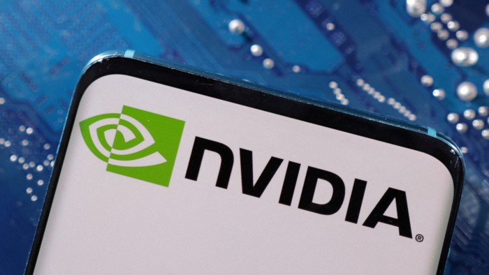 Nvidia logo on a smartphone in front a computer motherboard