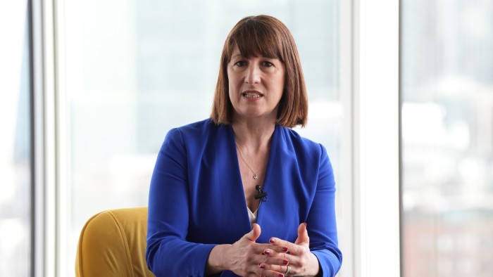 Rachel Reeves is speaking to the media during a press conference.