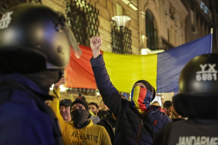 Calin Georgescu supporters shout slogans during a protest in front of the Central Elections Bureau in Bucharest,