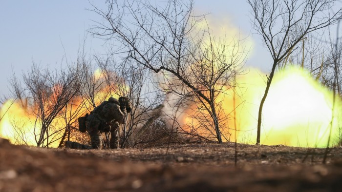 An artillery unit fires a D-30 howitzer on the frontline