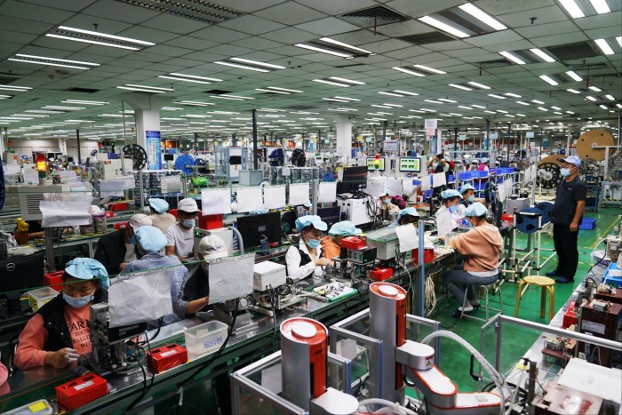 Employee work at a Foxconn factory in Zhengzhou