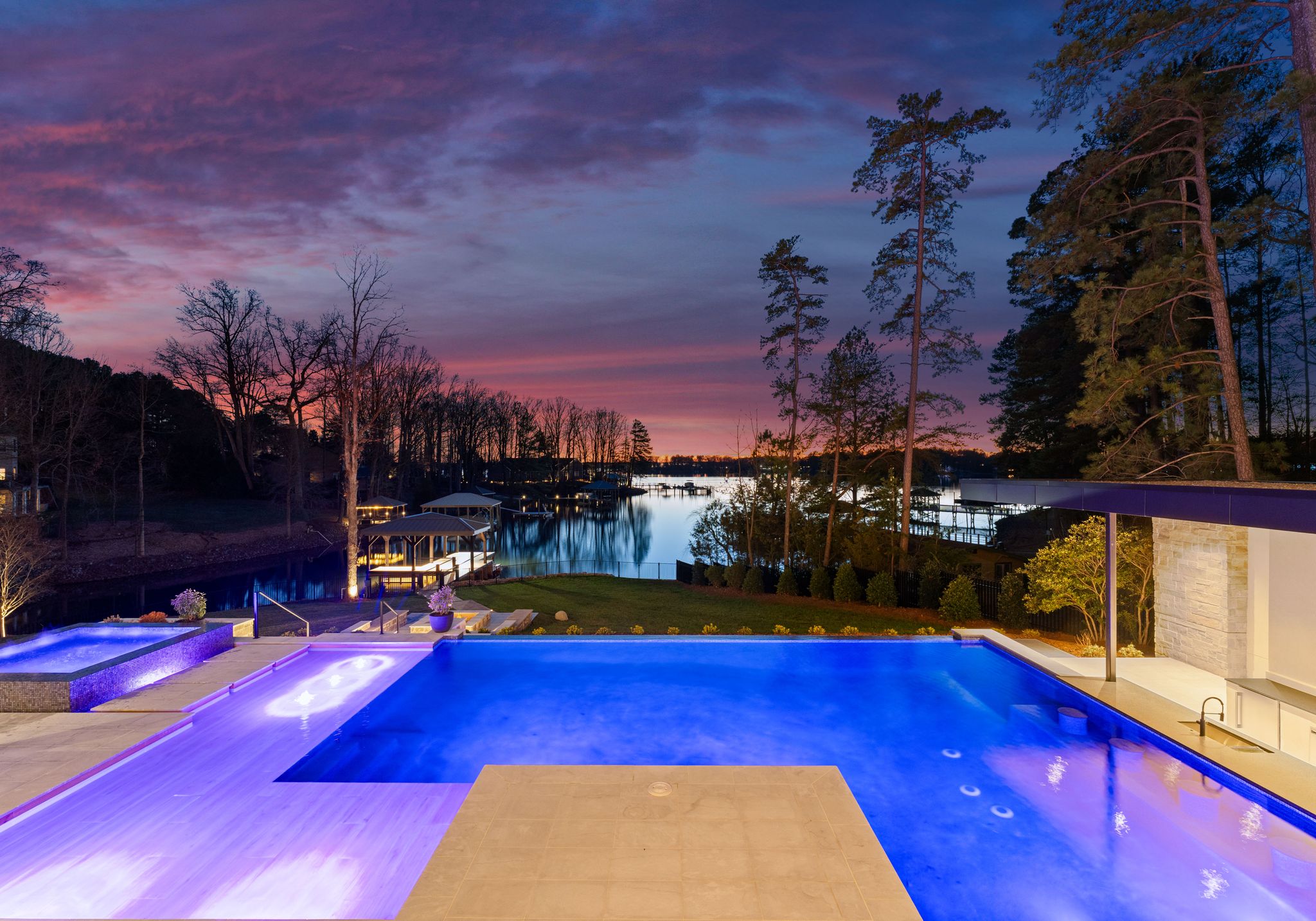 Swimming pool at night overlooking Lake Norman