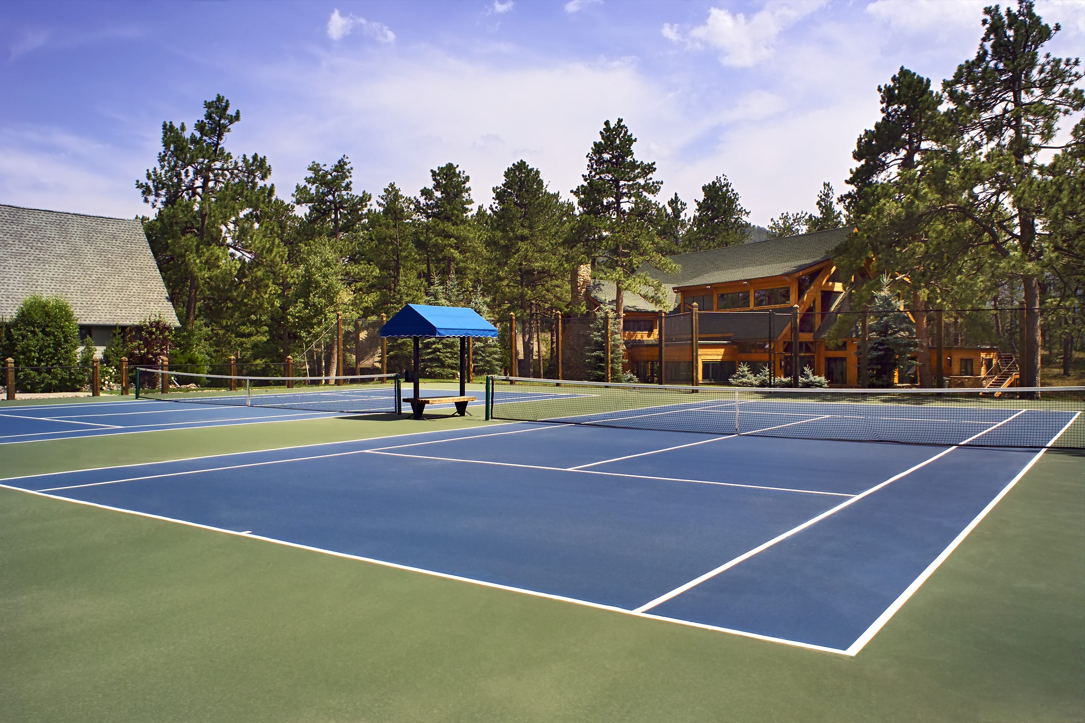 Tennis courts in grounds of luxury home, Colorado