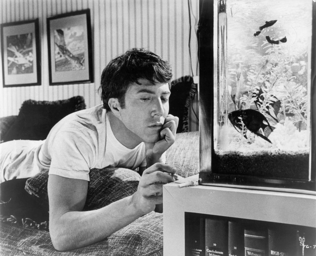 Dustin Hoffman In 'The Graduate.' Dustin Hoffman plays with his ashes from his cigarette in a scene from the film 'The Graduate', 1967. (Photo by Embassy Pictures/Getty Images)