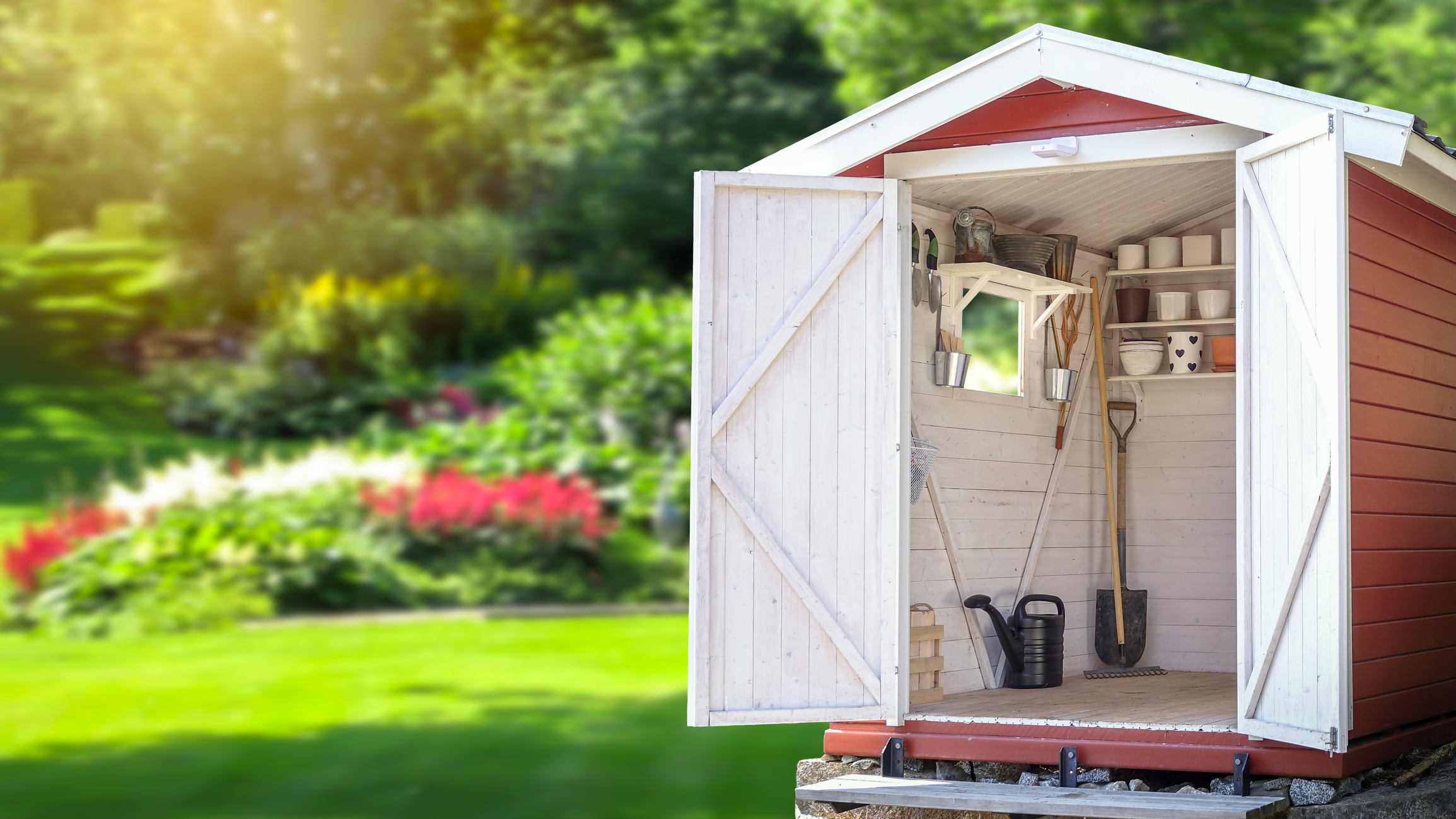 Storage shed filled with gardening tools.