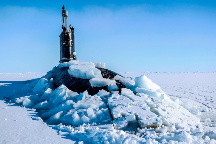 Royal Navy submarine HMS Trenchant breaks through the ice of the North Pole
