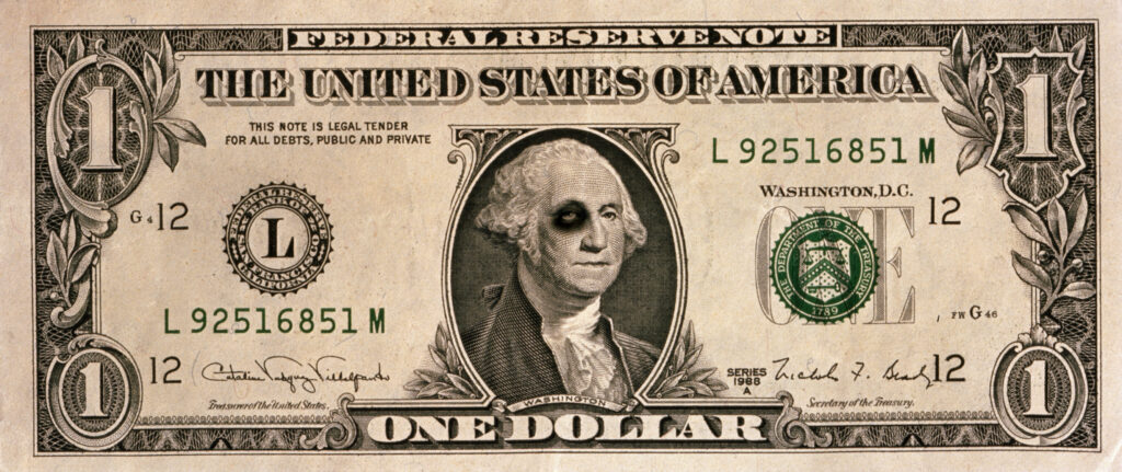 US one dollar banknote, George Washington with black eye.