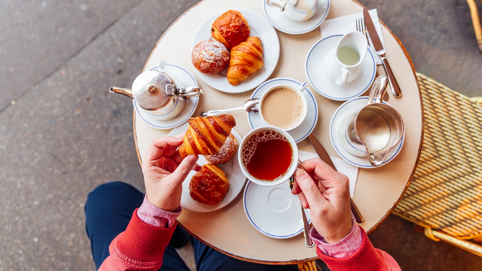 Croissants and tea on a table in Paris, France.