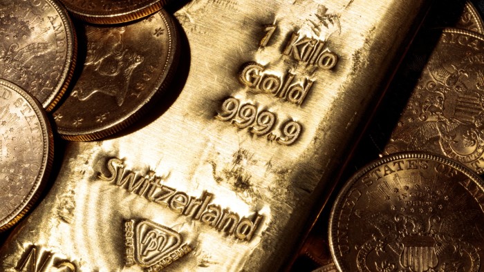 A one kilo Swiss gold bar and US dollars gold coins