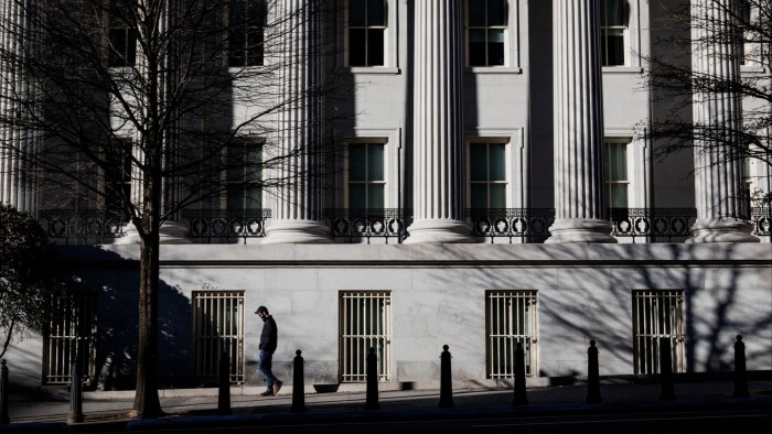 Shadows are cast over the front of the US Treasury building in Washington DC