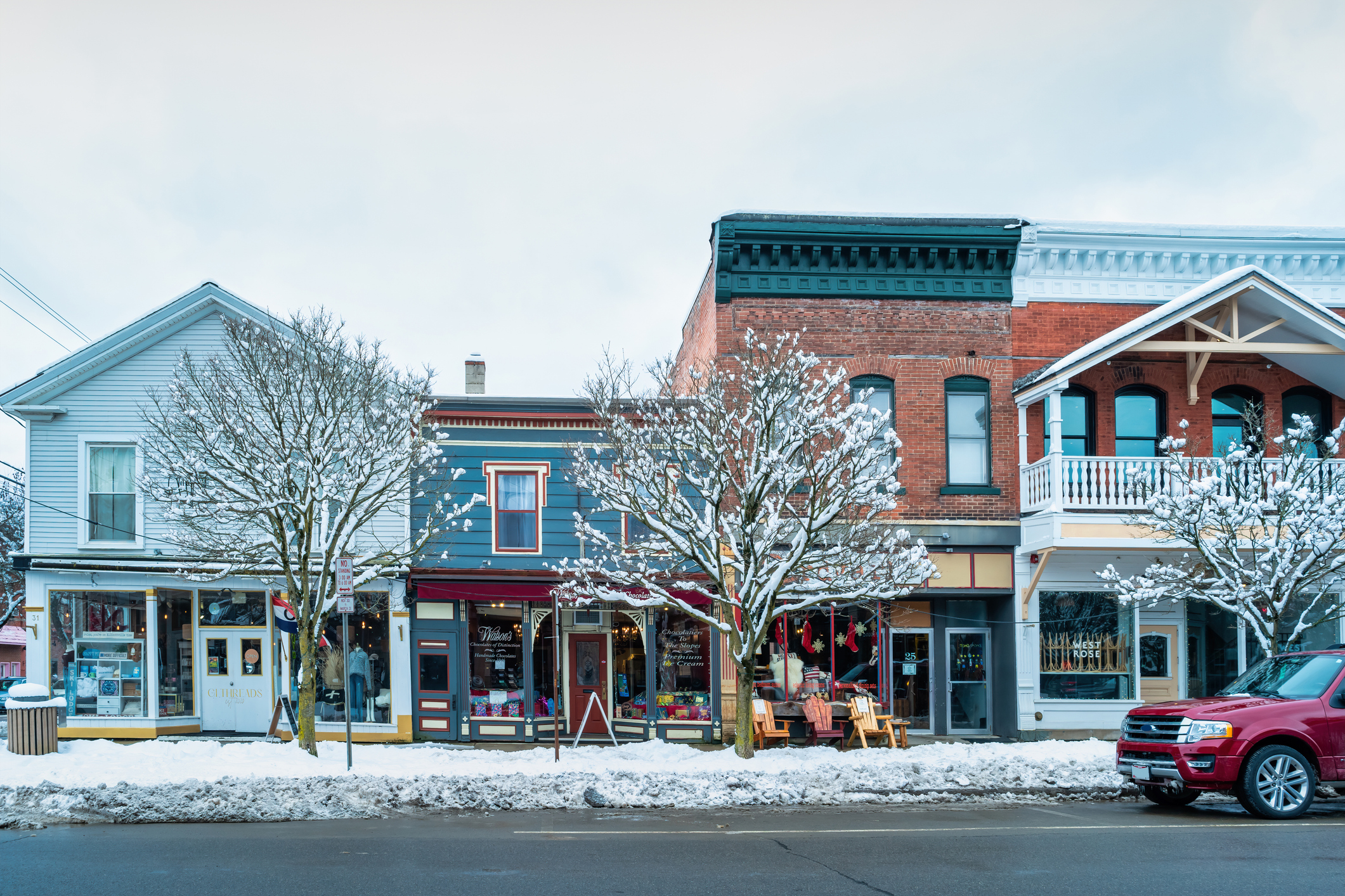 Snow-covered stores in downtown Ellicottsville, NY