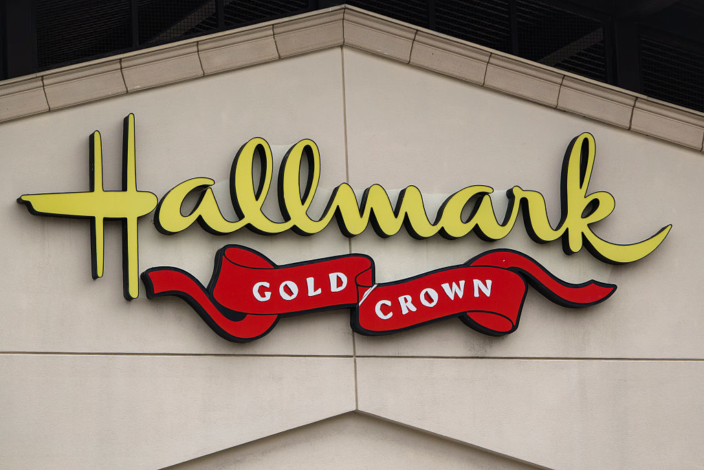 A Hallmark logo is displayed outside one of their stores on March 23, 2025 in San Diego, California. (Photo by Kevin Carter/Getty Images)
