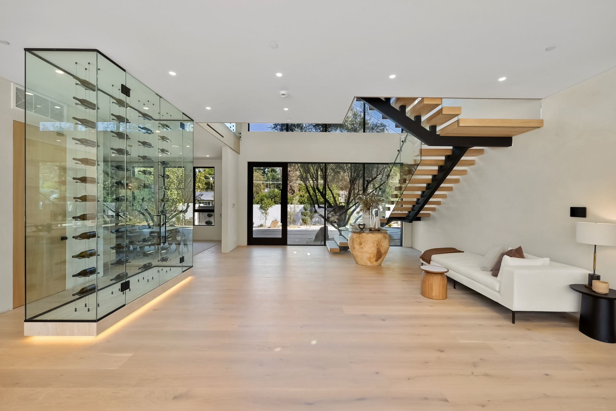 A modern home with a display-case style wine cellar.