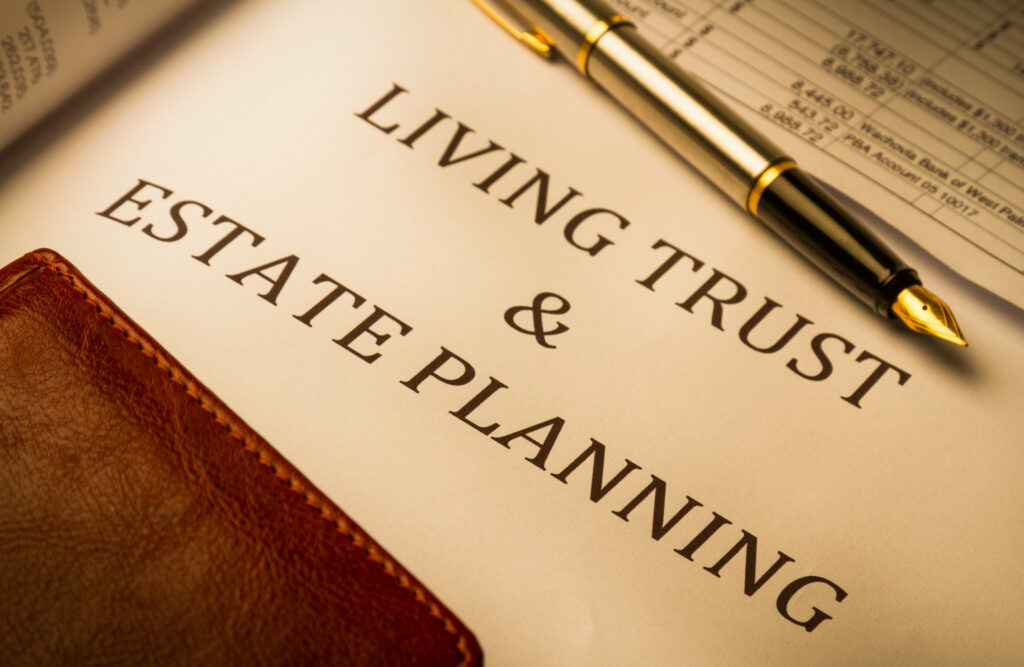 "Living Trust and Estate Planning" printed on paper, with fountain pen and leather book