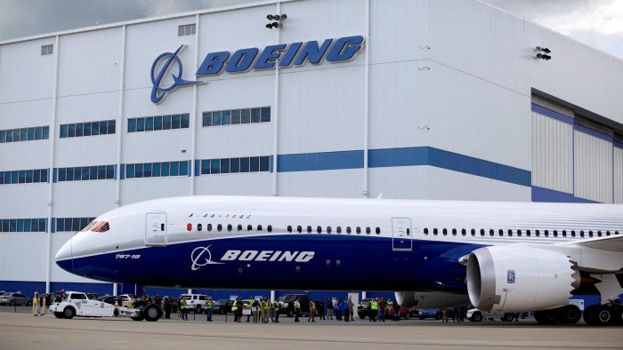 A Boeing 787-10 Dreamliner is shown taxiing past the Final Assembly Building at Boeing South Carolina in North Charleston