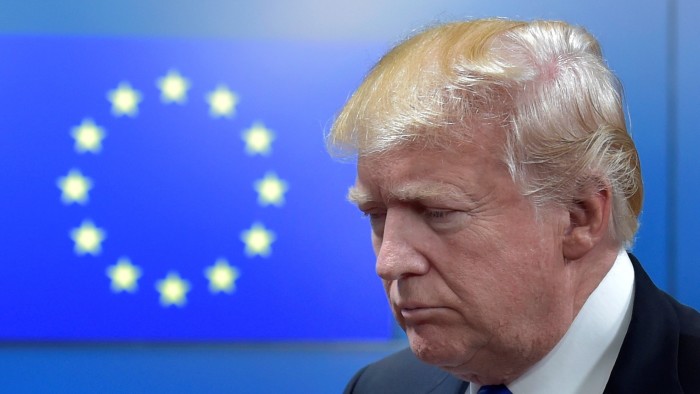 Donald Trump with the circle of 12 gold stars representing the EU in the background