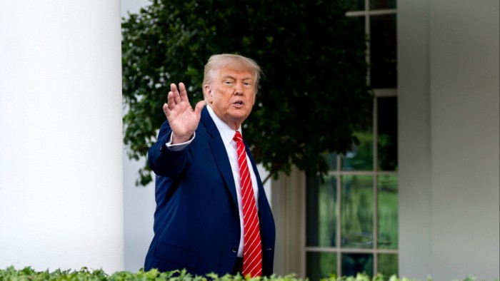 Donald Trump gestures outside the White House