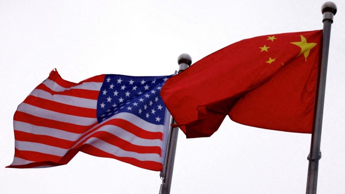 The Chinese and US flags are seen fluttering side by side