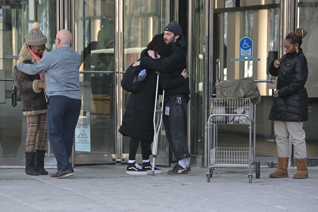 Former Internal Revenue Service workers leave their office after being laid off in downtown Denver, Colorado on Thursday, February 20, 2025. The IRS began laying off roughly 6,000 employees in the middle of tax season as the Trump administration via the Department of Government Efficiency (DOGE) works to downsize the federal workforce.
