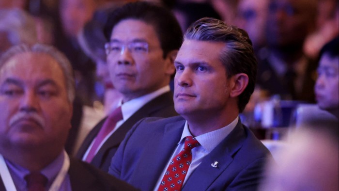 Singapore’s prime minister Lawrence Wong, second left, and US secretary of defence Pete Hegseth, centre, look on as French President Emmanuel Macron delivers a keynote address during the IISS Shangri-La Dialogue in Singapore on May 30 2025