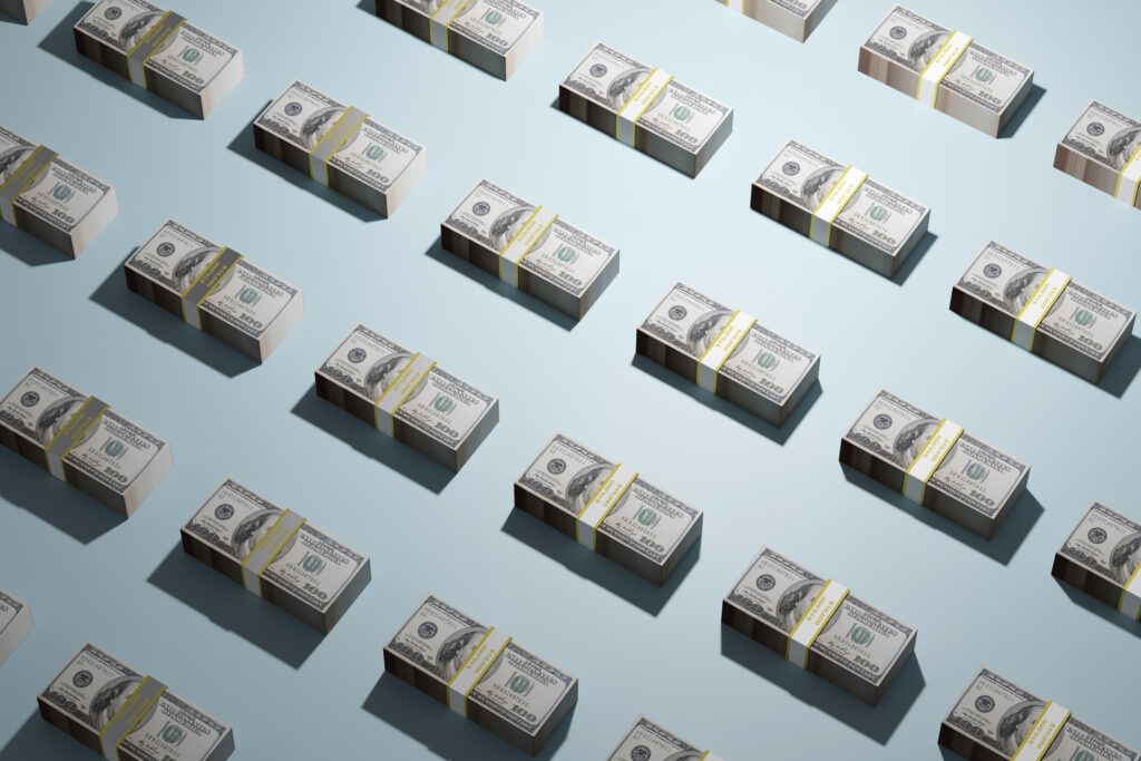 Stacks of American 100 dollar bills in a grid formation, ad infinitum.