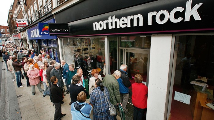 Customers wait in line to remove their savings from a branch of Northern Rock in 2007