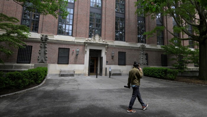A student walks on the campus of Harvard University in Cambridge, Massachusetts