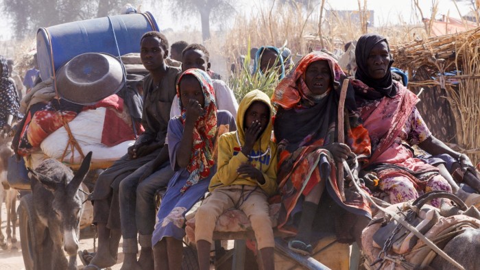 Refugees flee an attack on a displacement camp in the Sudanese town of Tawila