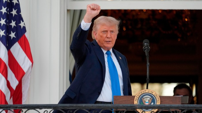 President Donald Trump raises his fist