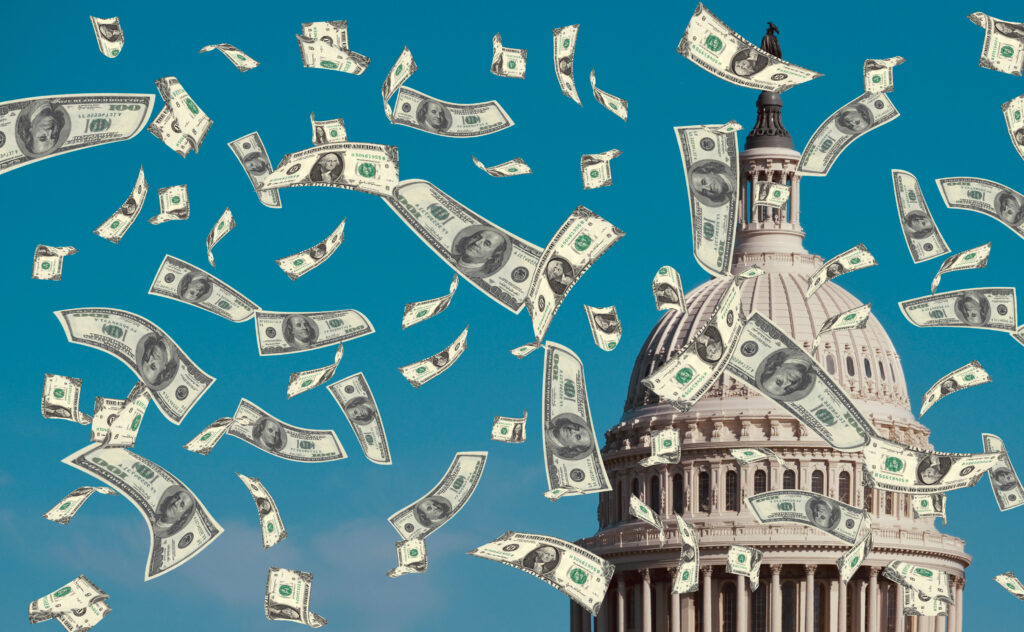 rendering of the top of the US capitol building with money flying around it