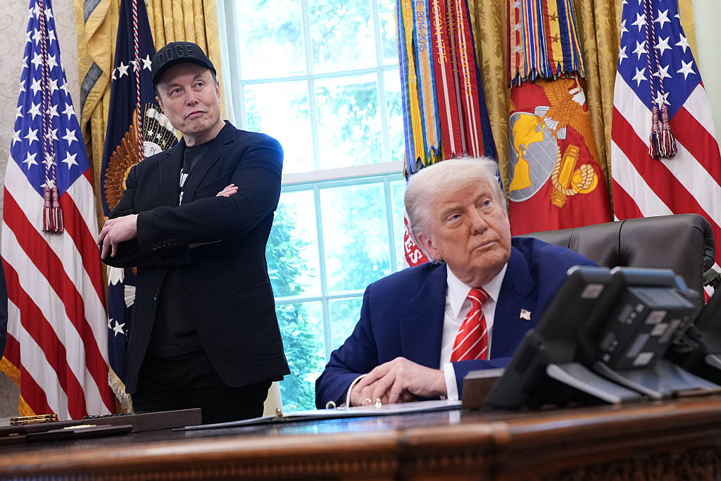 Tesla CEO Elon Musk and U.S. President Donald Trump listen to a question from reporters in the Oval Office of the White House on May 30, 2025 in Washington, DC