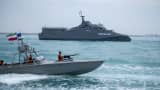 The IRGC Navy Martyr Hassan Bagheri warship and an IRGC speed boat are sailing along the Persian Gulf during the IRGC marine parade, which is commemorating the Persian Gulf National Day, near the Bushehr nuclear power plant in the seaport city of Bushehr, Bushehr province, in the south of Iran, on April 29, 2024. 