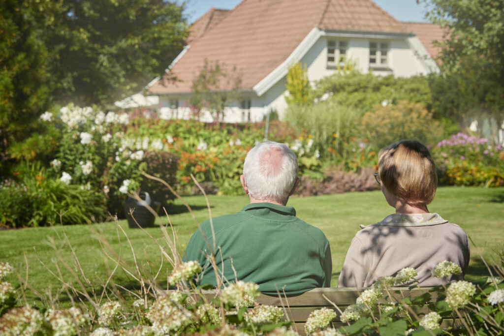 retired couple in a garden