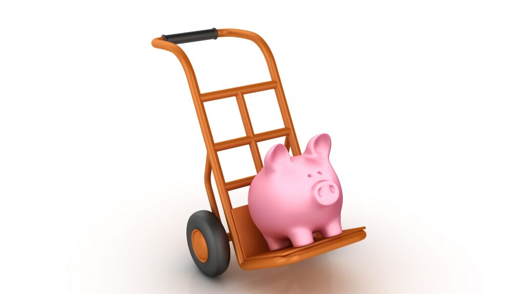 A piggy bank is on the move on a hand truck.