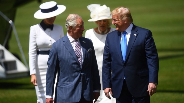 President Trump walks with Britain’s then Prince Charles, left, while First Lady Melania Trump walks with Camilla, Duchess of Cornwall, right, on day one of his first state visit on June 3 2019 at a welcome ceremony at Buckingham Palace in central London