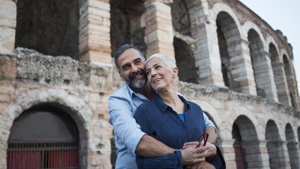 A retired couple on vacation in Verona, Italy.
