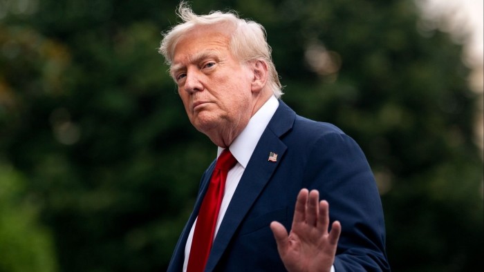 US President Donald Trump walks on the south lawn of the White House on Sunday