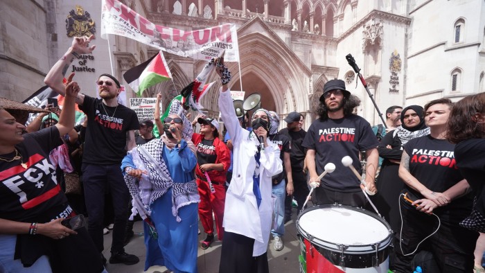 Protesters outside the Royal Courts of Justice on The Strand, central London, ahead of a hearing over whether proscribing of Palestine Action should be temporarily blocked