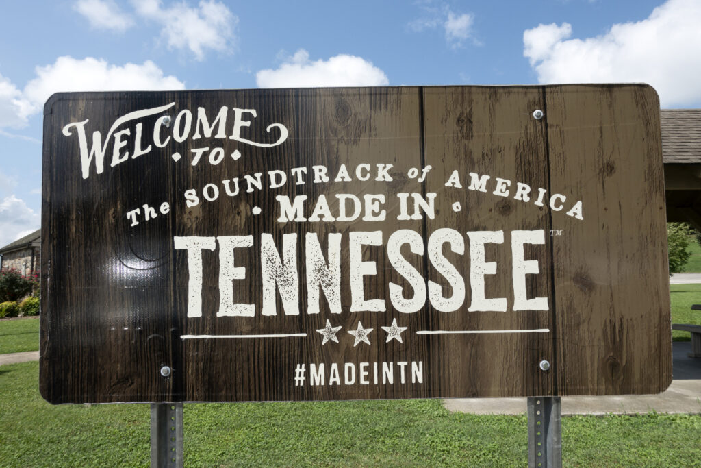 wooden sign that reads "Welcome to the soundtrack of America made in Tennessee"