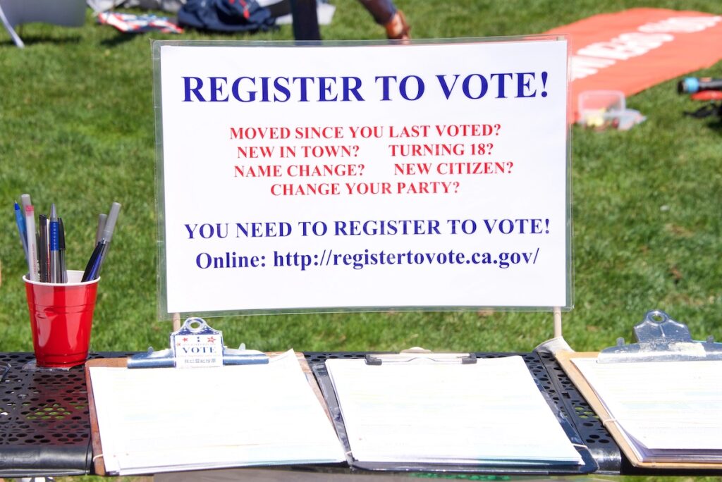 San Francisco, CA - Register to vote table set up at the "Families Belong Together" protest at City Hall, protesting Trump's "Zero Tolerance" policy and the separation of more that 2,000 children | Photo by Sheilaf2002
