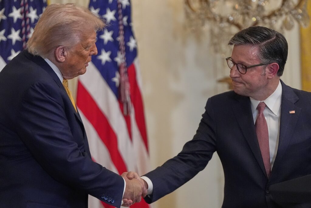President Donald Trump shakes hands with House Speaker Mike Johnson of La., during a reception for Republican members of Congress in the East Room of the White House, Tuesday, July 22, 2025, in Washington. (AP Photo/Julia Demaree Nikhinson)