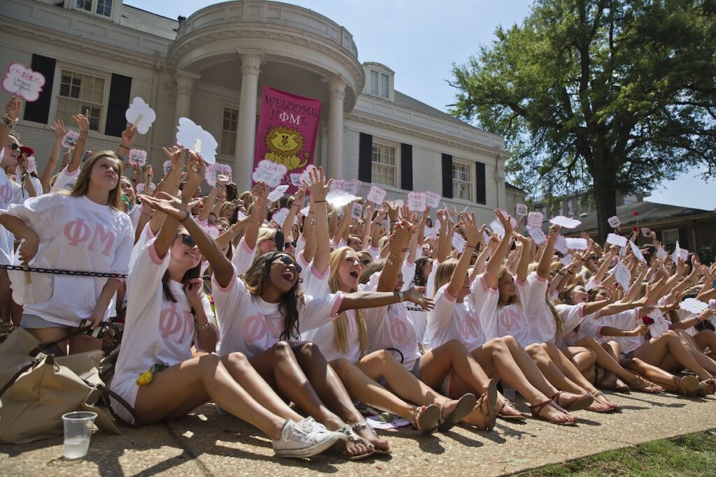 The University of Alabama Phi Mu's newest sorority members, in front, gather at sorority house for a photograph during Bid Day on Saturday, Aug. 16, 2014, in Tuscaloosa, Ala. The university became embroiled in controversy in 2013 after the student newspaper reported some white sororities had rejected blacks as new members because of race. At the end of 2014 sorority recruitment, black women made up 1 percent of new members. (AP Photo/Brynn Anderson)