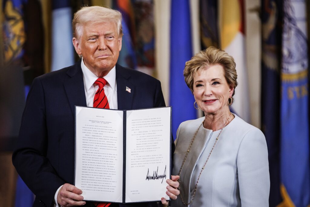 President Donald Trump holds the executive order to dismantle the Department of Education he just signed with Education Secretary Linda McMahon during an event in the East Room of the White House in Washington, D.C. on March 20, 2025. The Department of Education was first formed in 1980 by President Jimmy Carter and has long been a target for Republicans. (Photo by Samuel Corum/Sipa USA)(Sipa via AP Images)