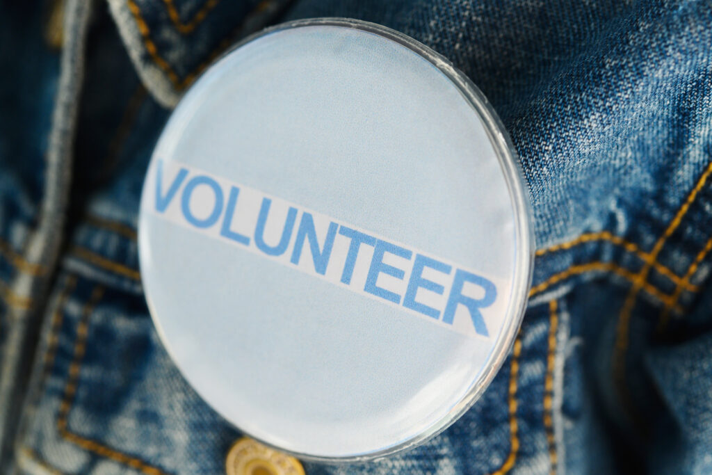 Volunteer pin on a jean jacket