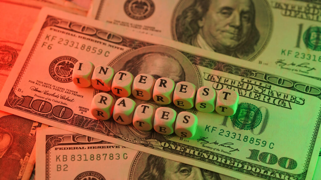 interest rates green red hundred dollar bills
