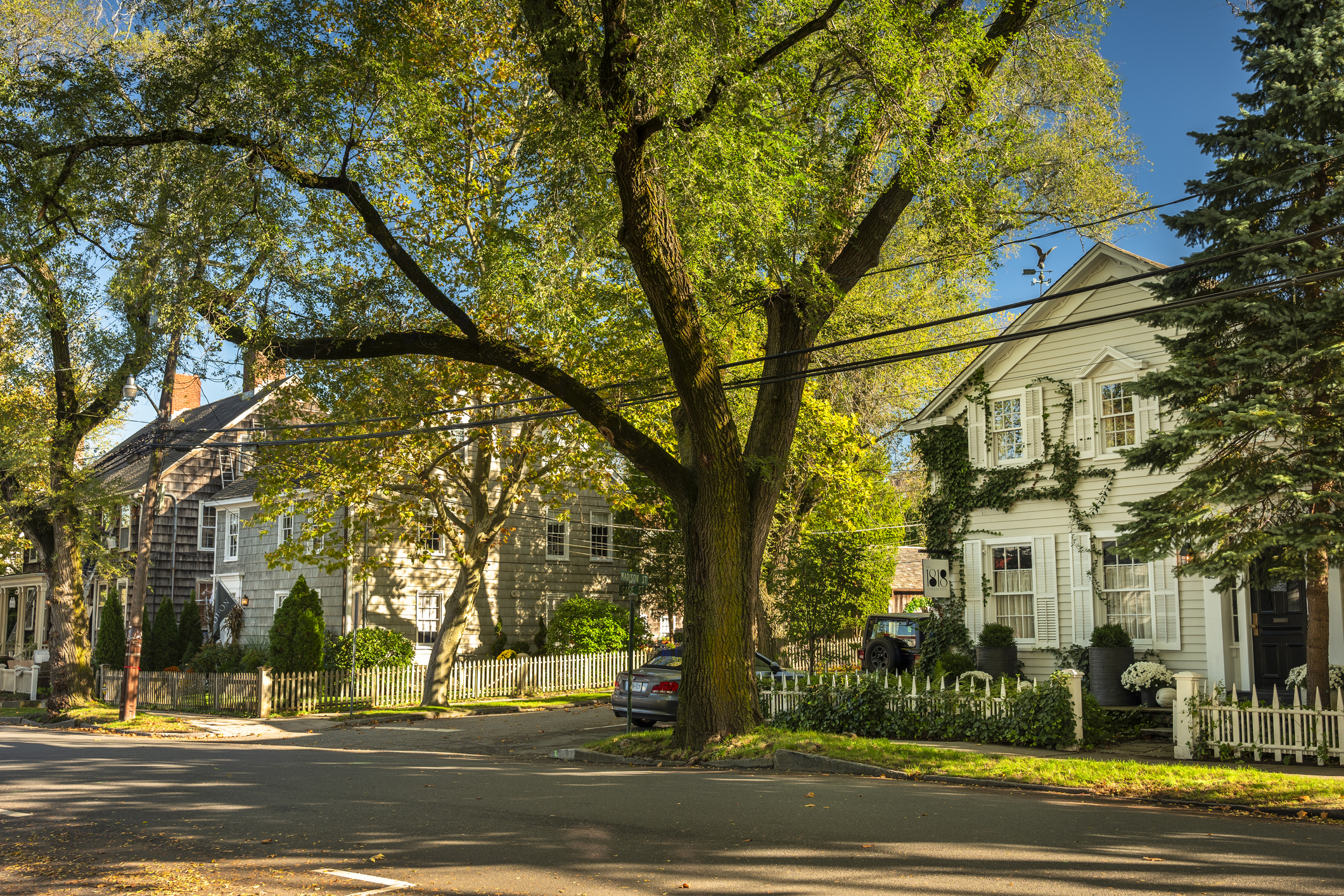 Sag Harbour, New York - October 27, 2022: Victorian clapboard houses along Main Street in the downtown village of Sag Harbor in The Hamptons, Long Island. Sag Harbor is an incorporated village in Suffolk County.