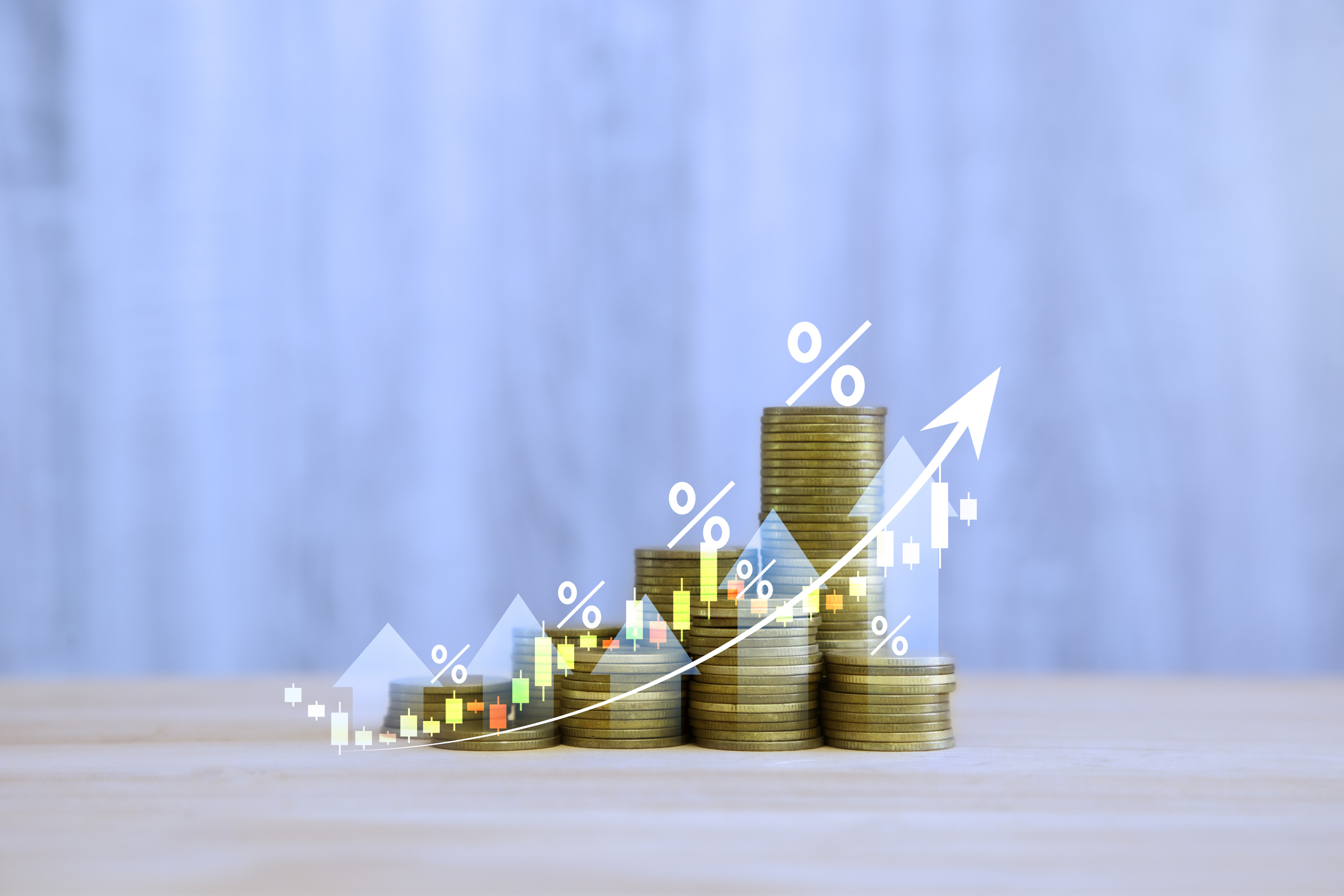 rising coin stacks up arrows growing percent signs